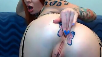 Redhead Webcam Model With Butterfly Tattoo